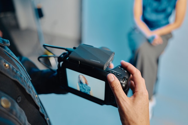 A person taking a picture with a camera