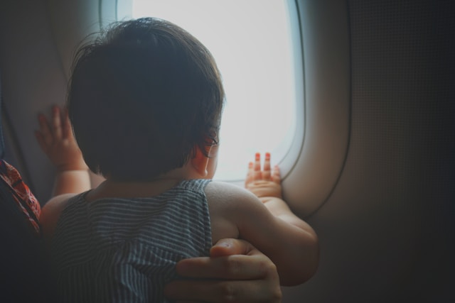 boy facing window